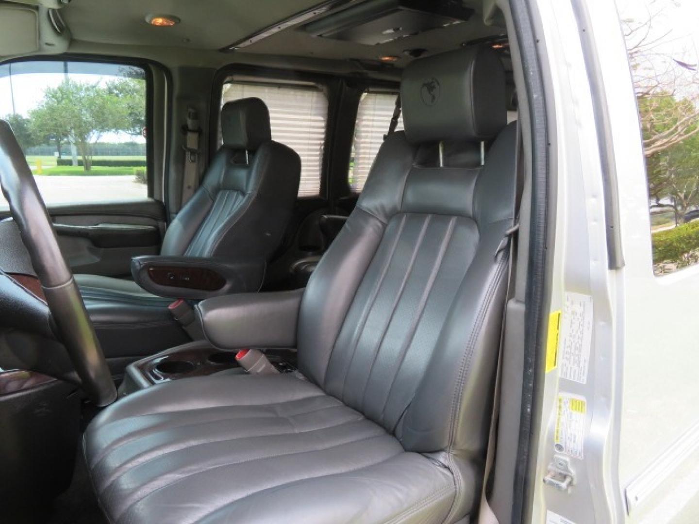 2014 Chevrolet Express (1GBWGLCG3E1) , located at 4301 Oak Circle #19, Boca Raton, FL, 33431, (954) 561-2499, 26.388861, -80.084038 - You are looking at a Rare 2014 Chevy Express 2500 Quigley 4x4 Four Wheel Drive Explorer Limited SE 9 Passenger Conversion Van with: 107K Original Miles, 6 Captain Chairs, Rear Power Folding Bench Seat Bed, Center Consoler Cooler, Front PPF (Paint Protection Film) Explorer Limited Conversion Througho - Photo#68